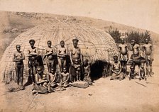 South Africa: Africans in front of a traditional kraal hut, between 1800 and 1899. Creator: Unknown.