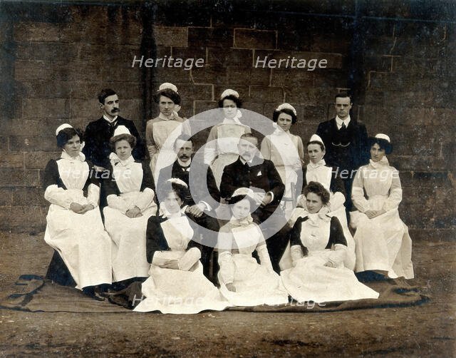 James Rutherford Morison with his staff: three men and ten women, c1900. Creator: Unknown.