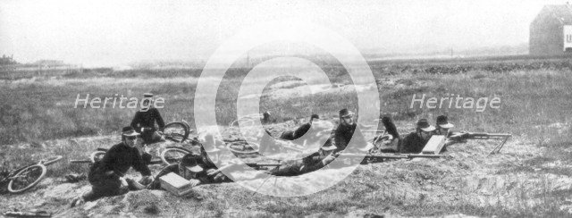 Belgian bicycle troops using Hotchkiss machine guns in Haelen, Belgium, August 1914.Artist: Montigny