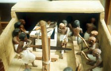 Carpenters in a workshop, model figures from an Ancient Egyptian tomb. Artist: Unknown