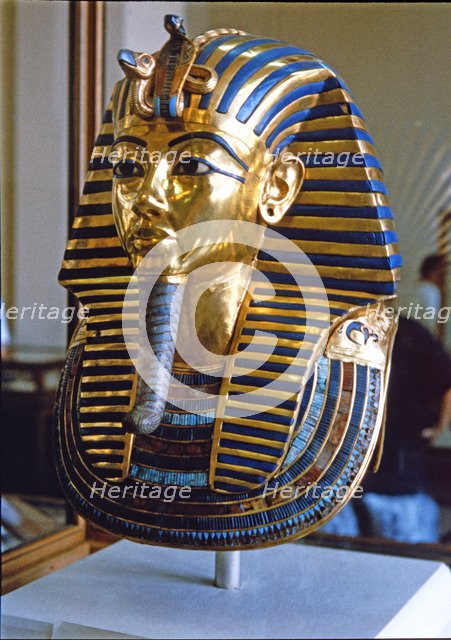 Tutankhamun death mask made of solid gold encrusted with precious stones, found by H. Carter in 1…