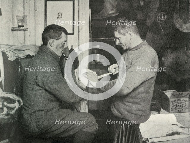 'Petty Officer Evans Binding Up Dr. Atkinson's Hand', 5 July 1911, (1913). Artist: Herbert Ponting.
