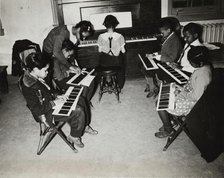 Children's piano class, Central Manhattan Music School, 1938. Creator: Solomon Horn.