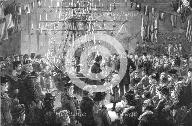 ''A Novel Treat to Coastguards Children; Dismantling a Christmas "Ship" of her toys', 1890. Creator: Fred Palmer.