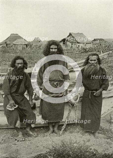 'Happu Konno, The Hunter (In Centre) and Two Ainu Fishermen', 1910. Creator: Herbert Ponting.
