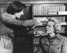 Margaret Thatcher being measured by Jean Fraser at Madame Tussauds, London, 10th April 1985. Artist: Unknown