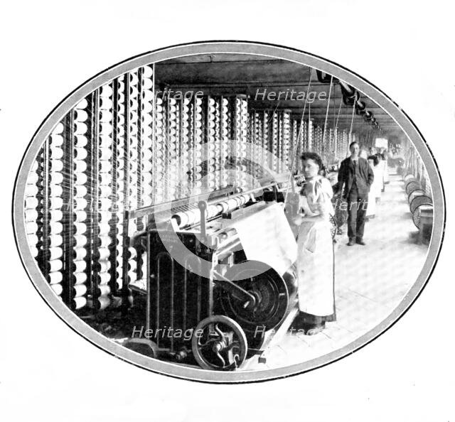 The device that winds the yarn off bobbins to form the warp of the web: warping-frames, 1909. Creator: Unknown.