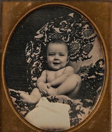 [Smiling, Nude Baby Holding Foot, Seated on Furniture Draped with Floral Print Fabric], 1850s. Creator: Unknown.