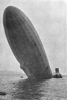 'Trois Zeppelins detruits en trois jours. Le "L20" dans un fjord de Norvege; L'avant dresse..., 1916 Creator: Unknown.