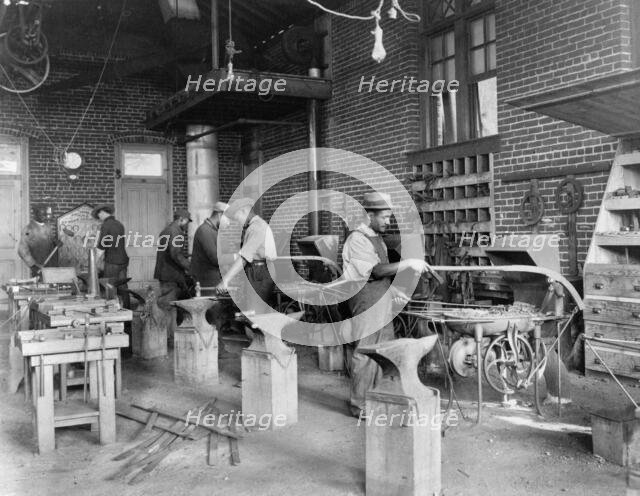 Young men training in blacksmithing at Hampton Institute, Hampton, Virginia, 1899 or 1900. Creator: Frances Benjamin Johnston.