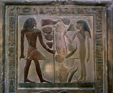 Door shaped stela representing Senouret and his wife in front of their offerings, made in polychr…