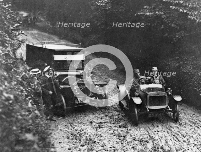 G.W.K passing Napier on very muddy track circa 1915. Creator: Unknown.