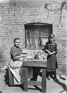 Assembling match boxes at home, 1900s. Artist: John Galt