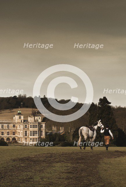 Re-enactor leading a horse towards Audley End House, Saffron Walden, Essex, 2010. Artist: Andrew Shaylor.