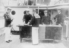 Paying sailors, British Navy, between c1910 and c1915. Creator: Bain News Service.