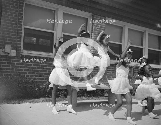 A dance group, Frederick Douglass housing project,Anacostia, D.C., 1942. Creator: Gordon Parks.
