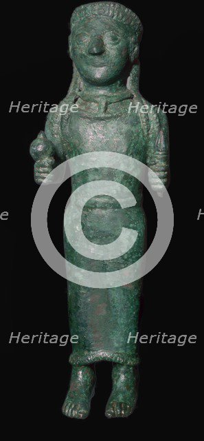 Greek bronze figure holding a pomegranate. Artist: Unknown