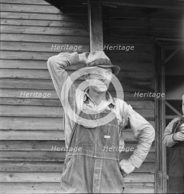Tobacco sharecropper tells about his prospects, Person County, North Carolina, 1939. Creator: Dorothea Lange.