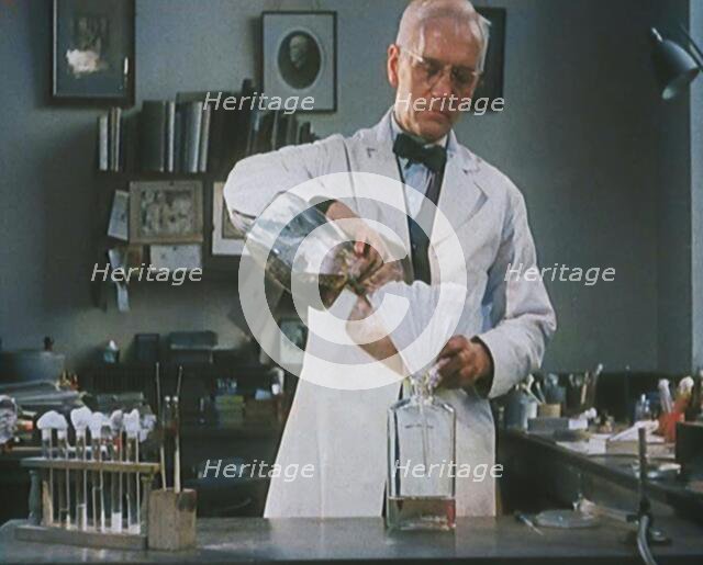 Dr Alexander Fleming, the Inventor of Penicillin, Experimenting in a Laboratory, 1929. Creator: British Pathe Ltd.