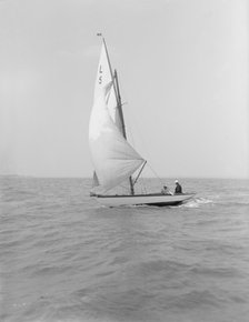 'Snowdrop' sailing under spinnaker, 1911. Creator: Kirk & Sons of Cowes.
