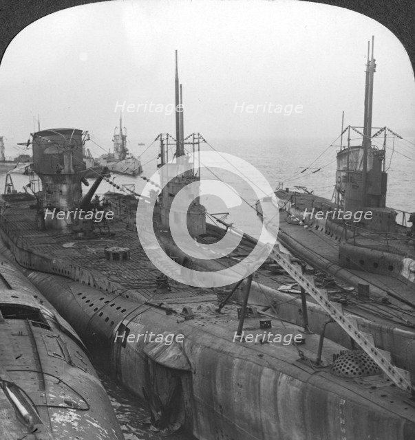 German submarines secured in a Channel port, c1918-c1919. Artist: Realistic Travels Publishers