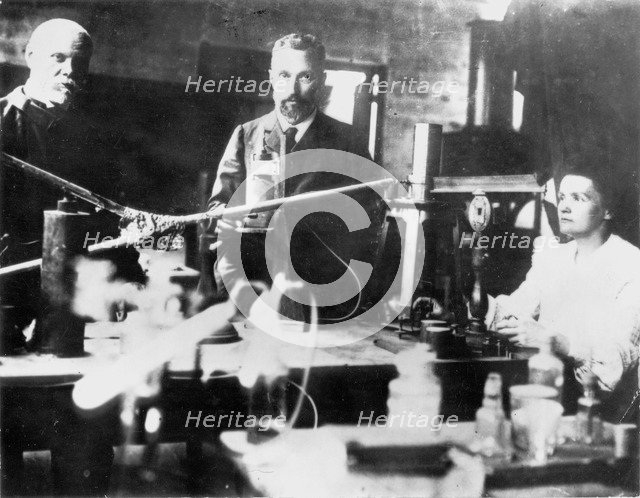 Pierre and Marie Curie, French scientists, at work in the laboratory. Artist: Unknown