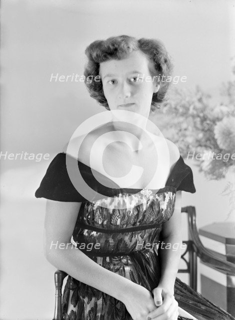 Portrait of seated woman in evening dress, (Isle of Wight?), c1935.  Creator: Kirk & Sons of Cowes.