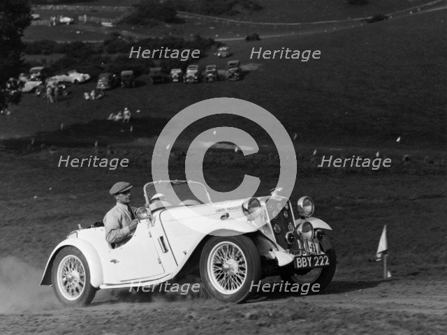 A Singer Nine Le Mans climbing a hill, 1935. Artist: Unknown