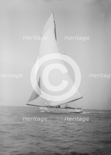 The 19-metre cutter 'Norada' sails in a following wind, 1911. Creator: Kirk & Sons of Cowes.