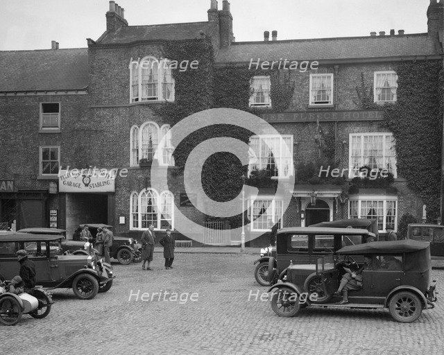 Cars parked outside the Fleece Hotel, Thirsk, Yorkshire, Ilkley & District Motor Club Trial, 1930s. Artist: Bill Brunell.