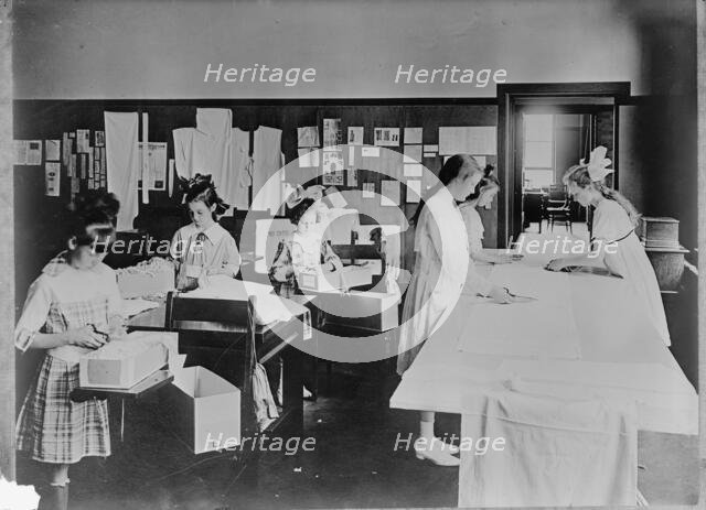 Red Cross Garment Division, Misc. Views of Work Rooms And Women Sewing, Knitting, Etc., 1917. Creator: Harris & Ewing.