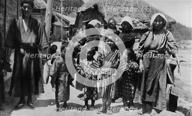 ''Large family of young fisherman at Nabuto, with nine children', c1900, (1921). Artist: Julian Leonard Street.