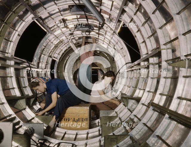 Women workers install fixtures and assemblies...Douglas Aircraft Company, Long Beach, Calif. , 1942. Creator: Alfred T Palmer.