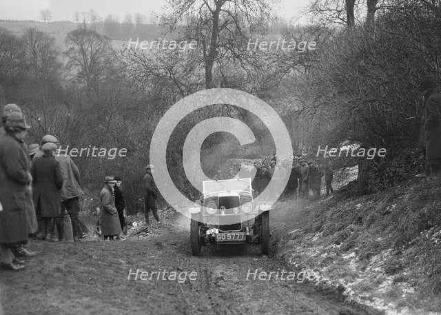 Alvis 12/60 of A Powys-Lybbe competing in the Sunbac Colmore Trial, Gloucestershire, 1933. Artist: Bill Brunell.
