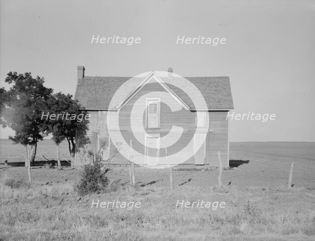 Vacant farmhouse in area of mechanization and drought near Olustee, Oklahoma, 1938. Creator: Dorothea Lange.