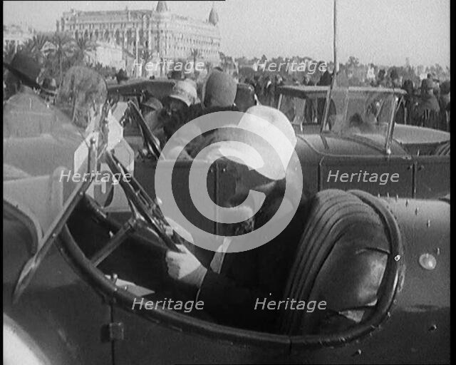 Female Civilian Wearing a Fur Trimmed Coat and Hat Sitting Behind the Wheel of a Car, 1920. Creator: British Pathe Ltd.