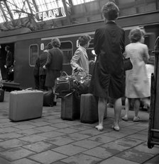 Passengers on a platform at Centraal Station, Amsterdam, Netherlands, 1963. Artist: Michael Walters