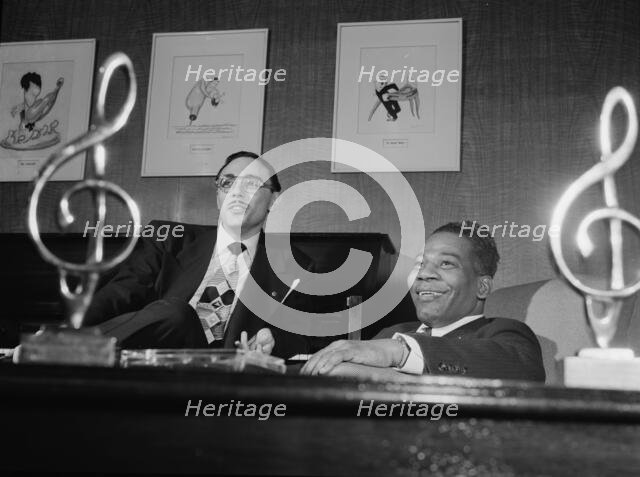 Portrait of Bernie Benjamin and George (George David) Weiss in their office, N.Y., ca. Apr. 1947. Creator: William Paul Gottlieb.