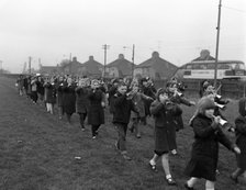 Children marching with home made bugles, Middlesborough, Teesside,1964.  Artist: Michael Walters