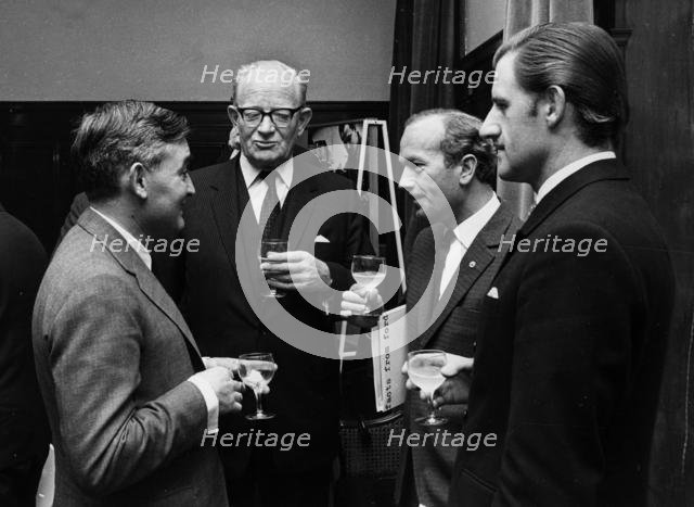Walter Hayes, Patrick Hennesey, Colin Chapman, Graham Hill. Creator: Unknown.