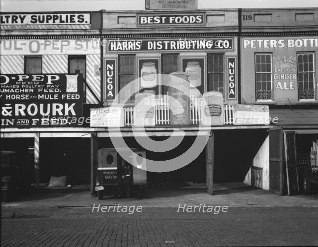 Waterfront warehouses, Louisiana, 1936. Creator: Walker Evans.