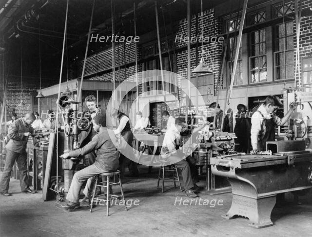 Young men training in use of machinery at Hampton Institute, Hampton, Virginia, 1899 or 1900. Creator: Frances Benjamin Johnston.