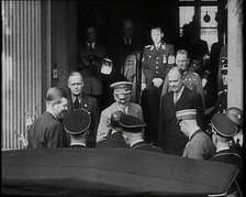 A Close up of Adolf Hitler, the German Leader, on the Front Steps of a Building Leaning..., 1938. Creator: British Pathe Ltd.