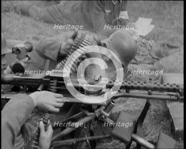 Two German Soldiers Firing a Machine Gun..., 1937. Creator: British Pathe Ltd.