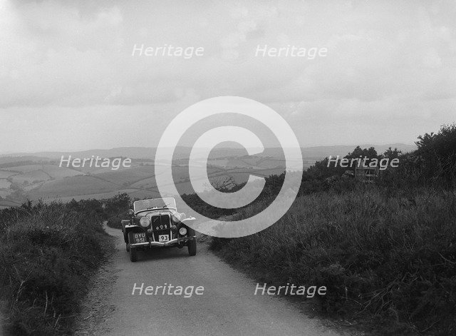 Jensen V8 of Alan Whiddington competing in the MCC Torquay Rally, 1938. Artist: Bill Brunell.