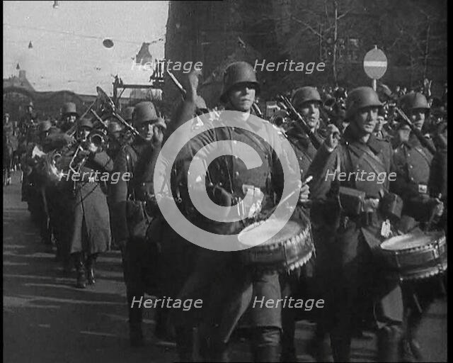 A German Military Band Marching Through the Rhineland, 1936. Creator: British Pathe Ltd.