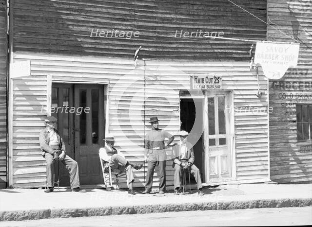 Vicksburg Negroes and shop front, Mississippi, 1936. Creator: Walker Evans.