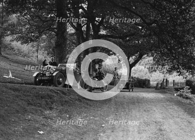 Wolseley Hornet and Morris Minor taking part in a motoring trial, c1930s. Artist: Bill Brunell.