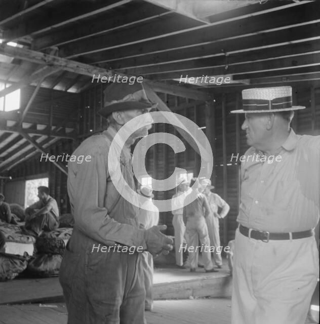 Each farmer follows his tobacco in the warehouse to learn what price..., Douglas, Georgia, 1938. Creator: Dorothea Lange.