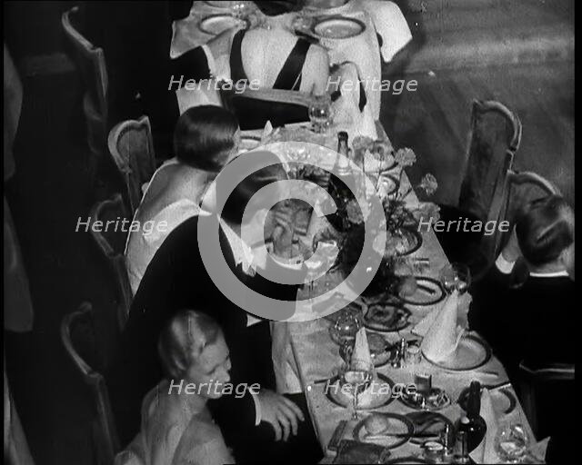 People Eating Dinner, 1930s. Creator: British Pathe Ltd.